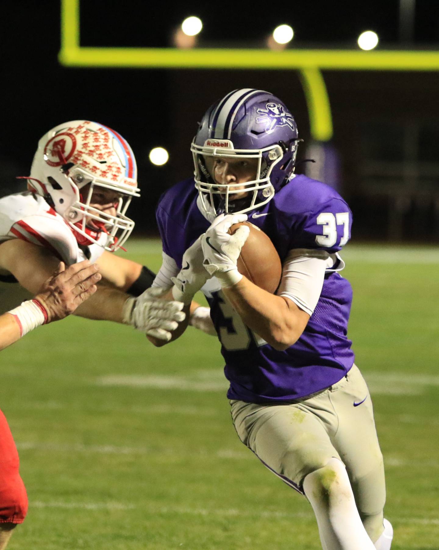 Rochelle's Jonathan Andrist (37) runs past an Ottawa defender during Friday's game in Rochelle.