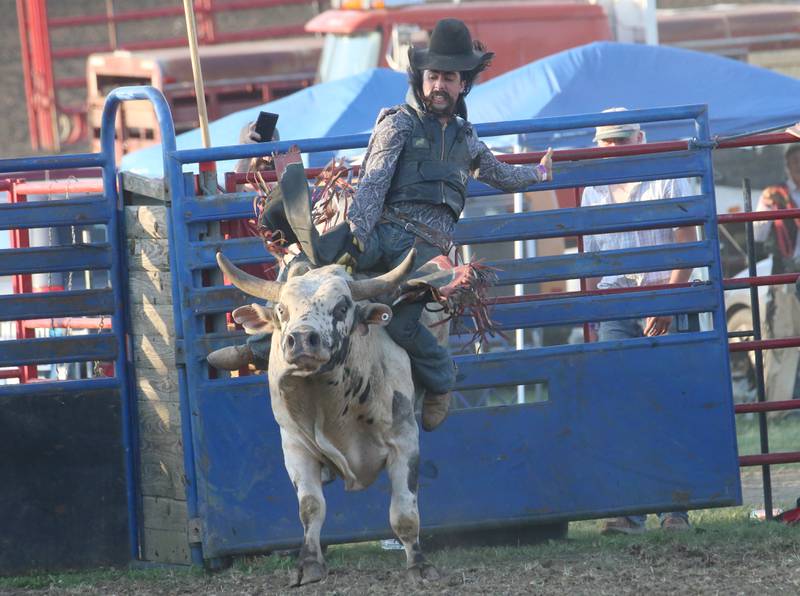 Ruben Saucedo of Peotone, rides a bull during the inaugural Starved Rock Rodeo on Saturday, June 21, 2025 at the La Salle Speedway.