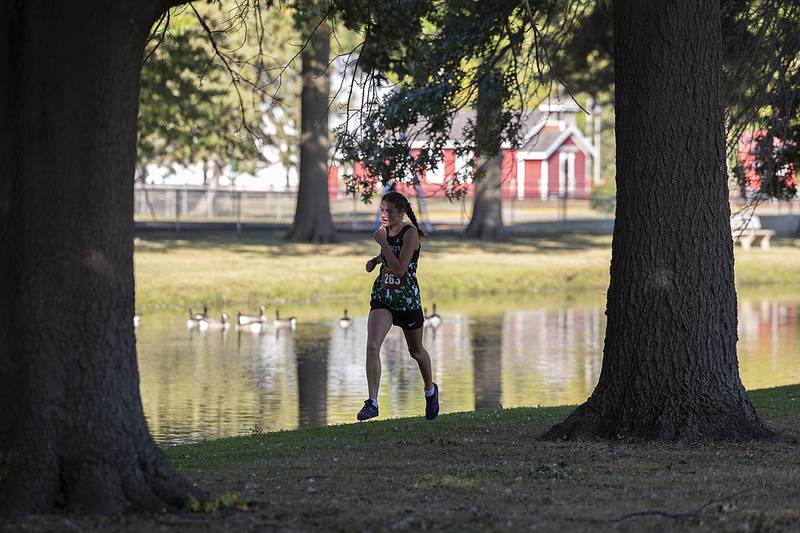 Rock Falls’ Ashley Rodriguez heads for the final turn for third place Tuesday, Sept. 16, 2025, at the Twin Cities Triangular in Rock Falls.
