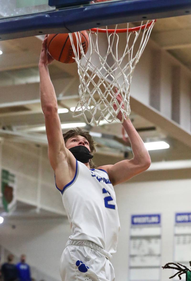 PHS junior Teegan Davis goes up for a first-half dunk against Rock Falls Saturday night at Prouty Gym.