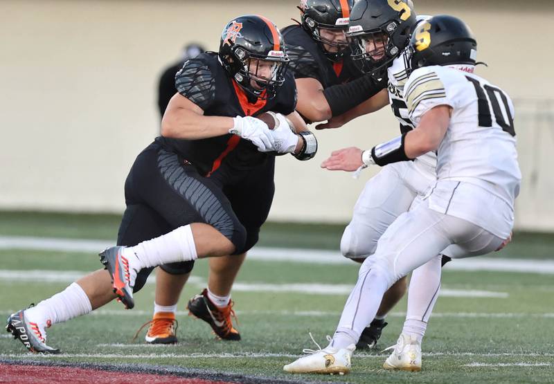 DeKalb's Talen Tate prepares to take on Sycamore's Zack Crawford during the First National Challenge Friday, Aug. 26, 2022, in Huskie Stadium at Northern Illinois University in DeKalb.