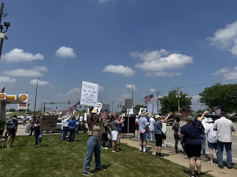 Protesters line up along the junction of US Route 6 and Illinois Route 47 for the No Kings Day protest in Morris on Saturday, June 14, 2025.