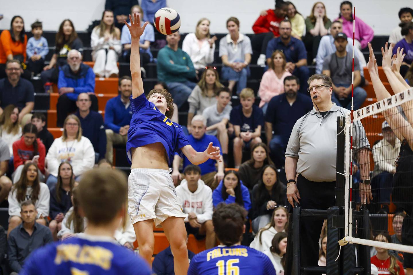 Wheaton North's Aidan Syswerda (12) moves the ball during the crosstown boys volleyball match Tuesday, April 28, 2026 in Wheaton.