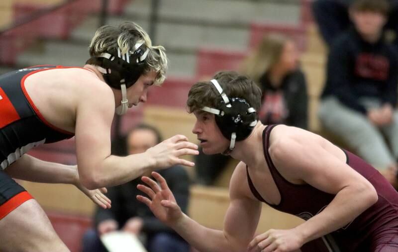 Huntley’s Owen Hurd, left, faces off against Prairie Ridge’s Matt Moritz at 150 pounds in varsity wrestling on Thursday, Jan. 23, 2025, at Huntley High School in Huntley.