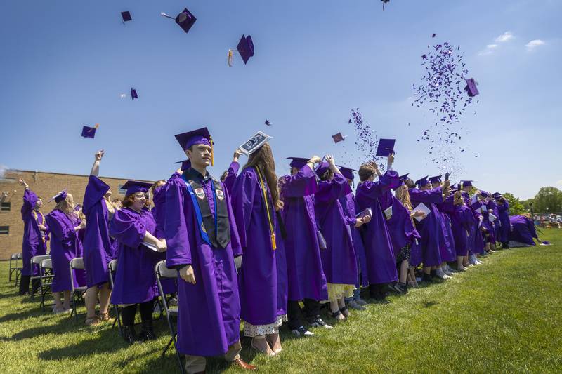 Members of the Dixon High School Class of 2026 fire their hats and confetti into the air at the end of their commencement ceremony Sunday, May 24, 2026.