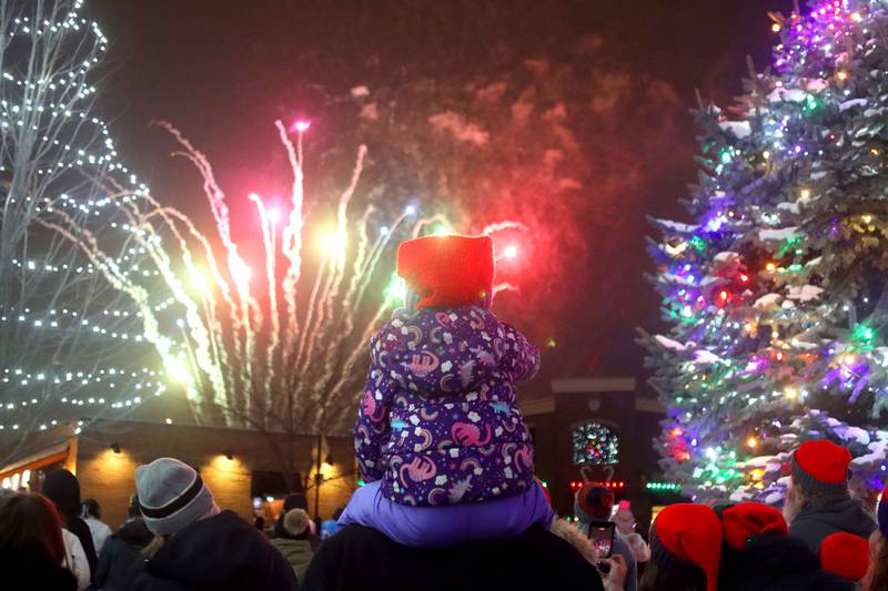 A child admires fireworks during A Very Merry Huntley on Saturday, Dec. 6, 2025.