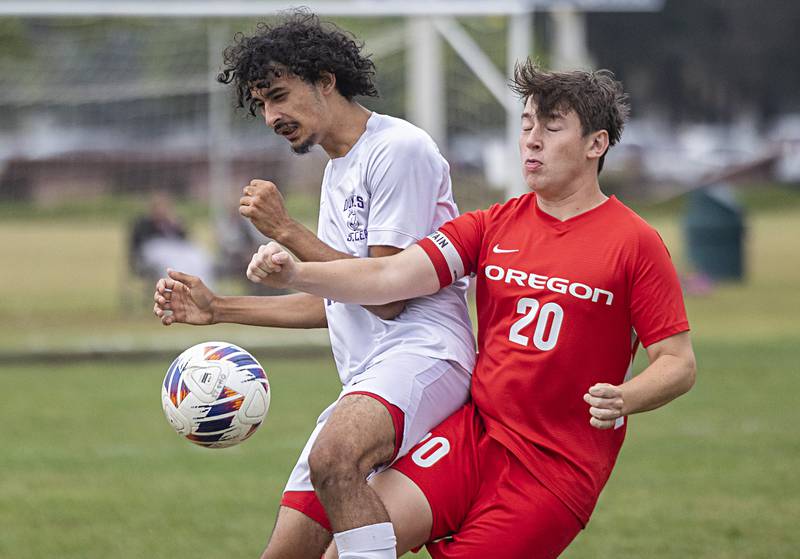 Dixon’s Kristian Prather (left) and Oregon’s Rivers Schafer battle for the ball Monday, Sept. 11, 2023 in Oregon.