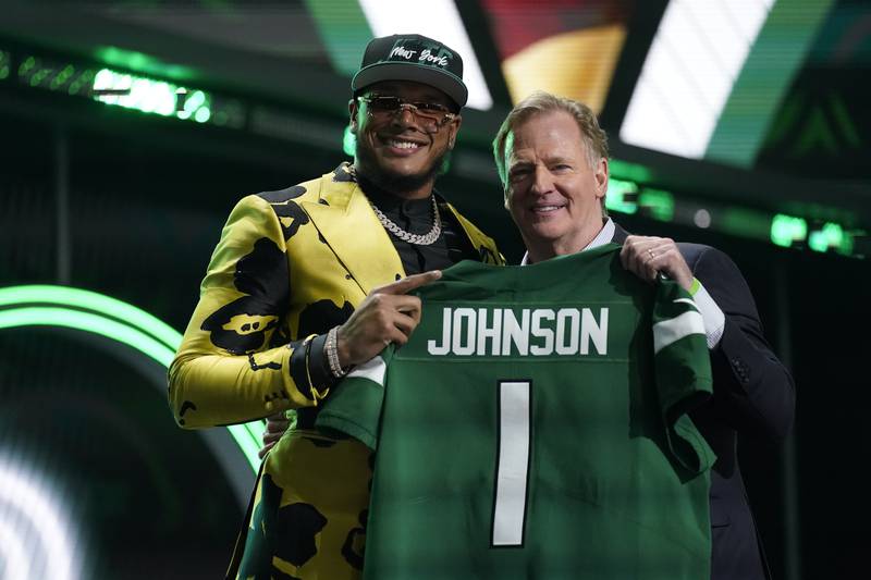 Florida State defensive end Jermaine Johnson II stands with NFL commissioner Roger Goodell after being chosen by the New York Jets with the 26th pick of the NFL draft Thursday, April 28, 2022, in Las Vegas.