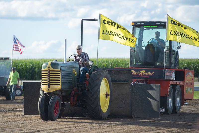 Bob Althous steers his rig down the track Thursday, July 28, 2022 during the 4750 tractor class pulls at the Lee County 4H fair.