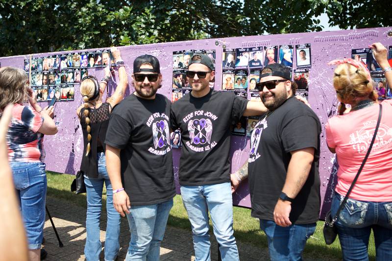 Jack, Nick and Frank Rumoro stand by the remembrance wall at the  9th Annual Ride for John for my child's life matters on Saturday Aug.2, 2025 in Carol Stream.
