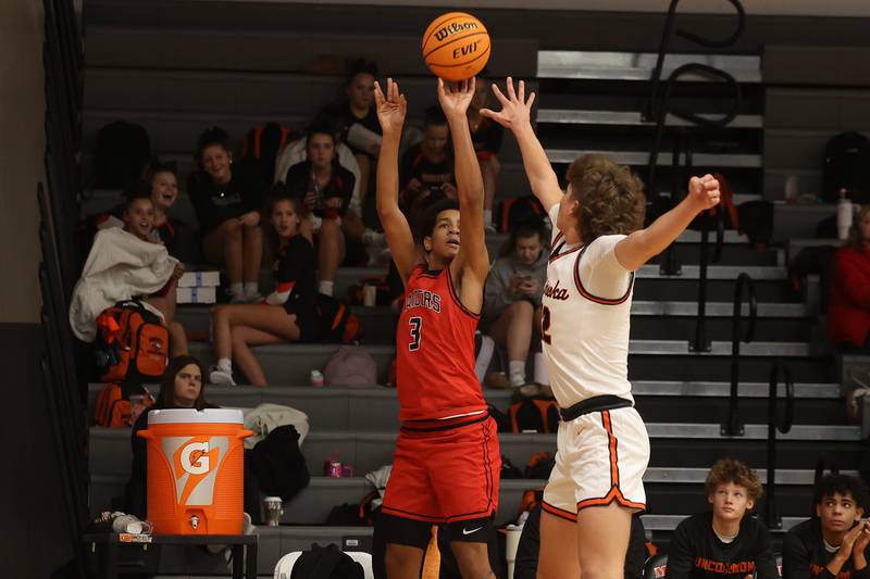 Bolingbrook’s Davion Thompson puts up the three point shot against Minooka on Tuesday, Dec. 17, 2024 in Minooka.