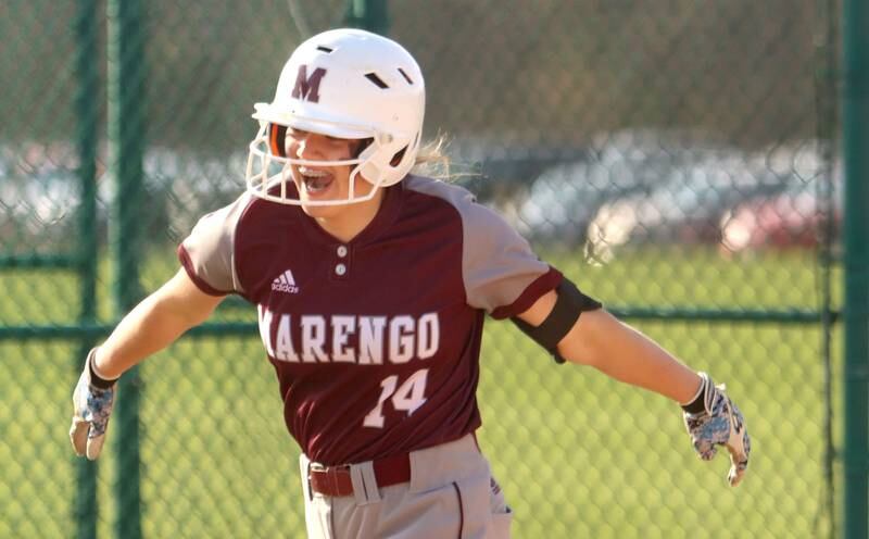 Marengo’s Kylee Jensen soars around third base after belting a home run against Richmond-Burton in varsity softball at Marengo Wednesday evening.