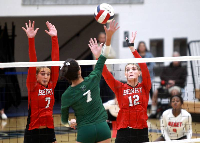 Benet’s Audrey Asleson (left) and Lynney Tarnow go up for a block during the Class 4A St. Charles North Supersectional on Monday, Nov. 11, 2024 against New Trier.