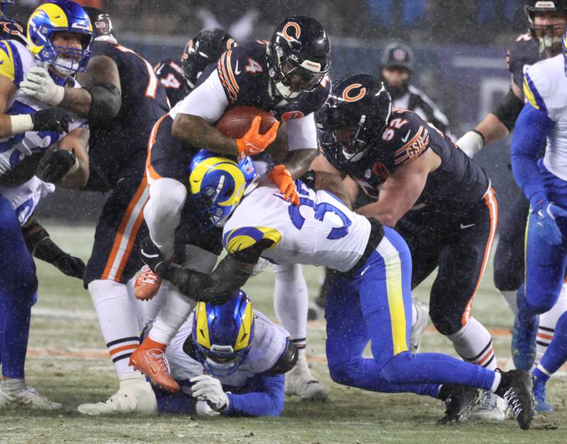 Chicago Bears running back D'Andre Swift tries to run through Los Angeles Rams safety Quentin Lake Sunday, Jan. 18, 2026, during their NFC divisional playoff matchup at Soldier Field in Chicago.