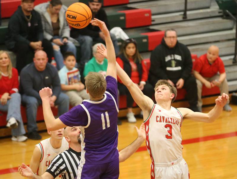 Rochelle's Brody Bruns wins the overtime tip over L-P's Braylin Bond on Friday, Feb. 13, 2026 in Sellett Gymnasium at L-P High School.