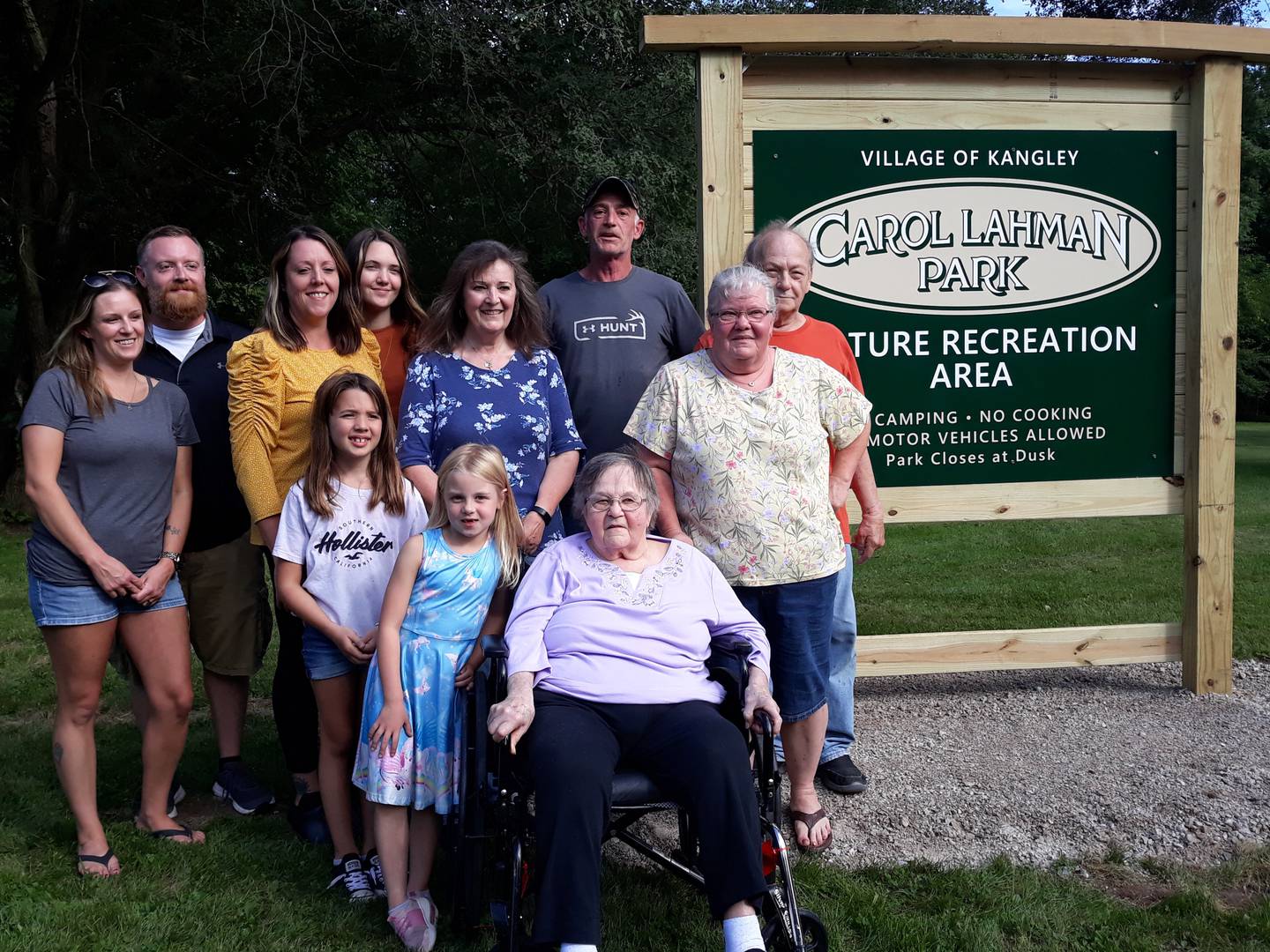 Four generations of the Lahman family visited the newly-named Carol Lahman Park in Kangley on Thursday, Sept. 1, 2022. (Left to right) Kim Lahman, Jake Lahman, Amber Bedeker, Morgan Bedeker, Madison Bedeker, Aubrey Lahman, Cindy Washko, Dave Lahman, Kim Lahman and Terry Washko pose for a photo with Carol.