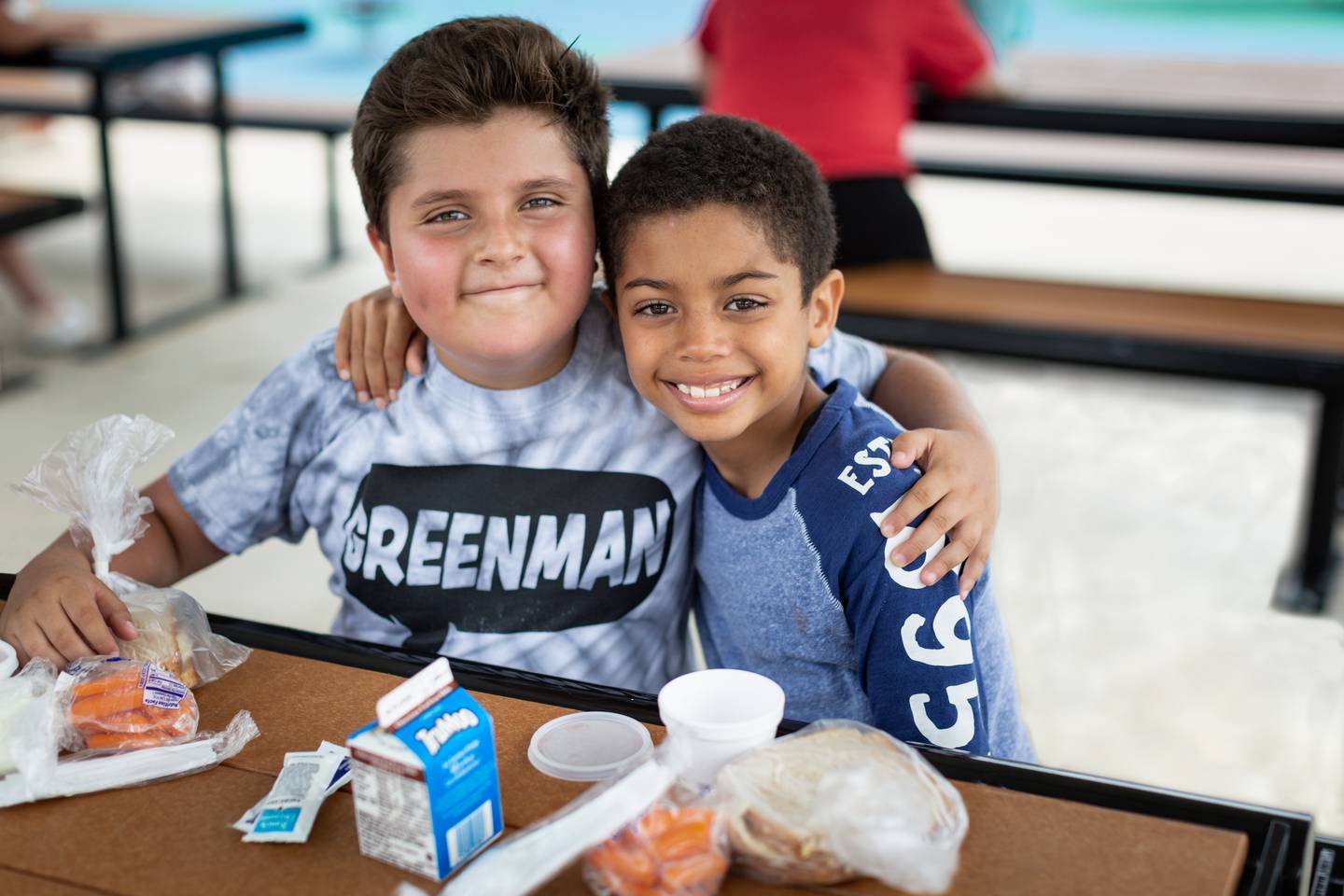 Friends have lunch at one of the Northern Illinois Food Bank's free summer lunch programs. The food bank, based in Geneva, provides 56 sites for free lunch for children who would otherwise have free breakfast or lunch while school is in session.