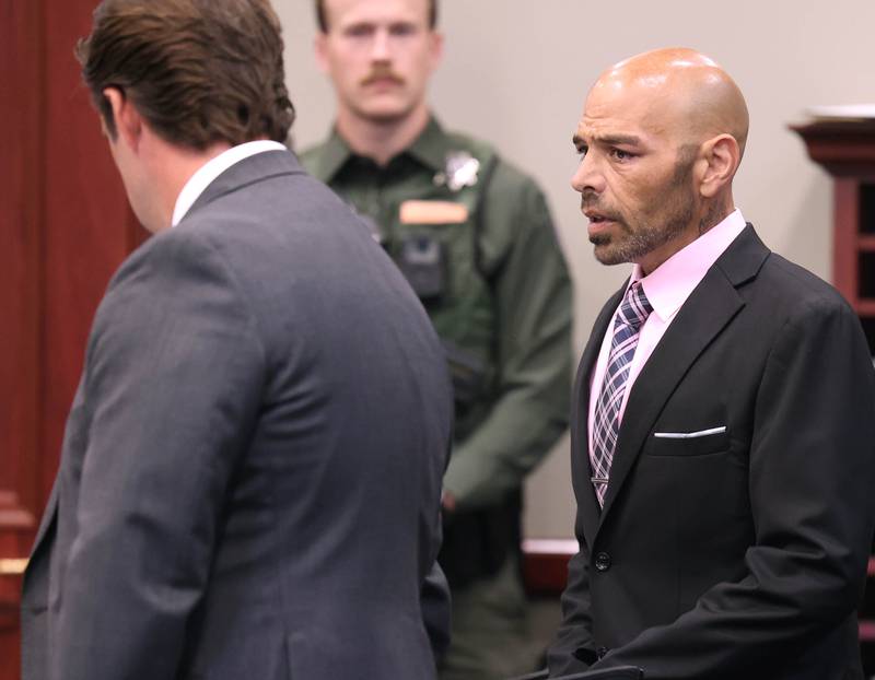 Nathan P. Sweeney, (right) 45, of DeKalb, talks to his attorney John Kopp Tuesday, Aug. 26, 2025, as he enters the courtroom for his sentencing hearing at the DeKalb County Courthouse in Sycamore. Sweeney received 14 years in prison for driving under the influence and causing the 2024 crash that killed sheriff’s deputy, veteran and mother Christina Musil.