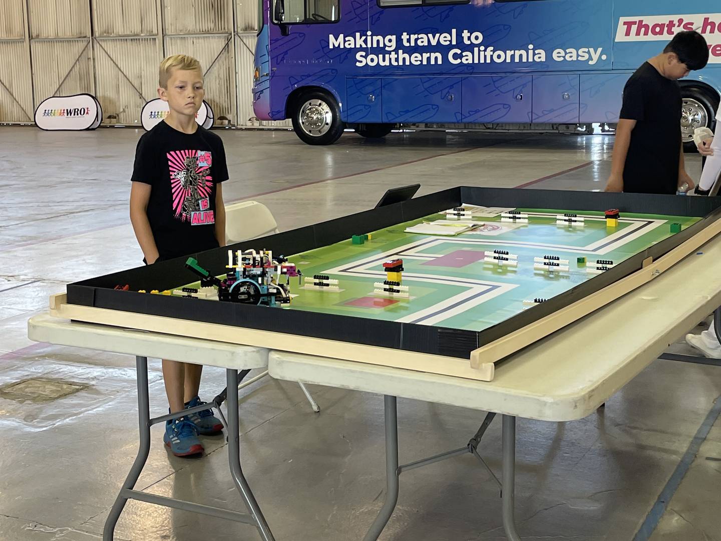 Sawyer Rinn, 10, a fourth grader at Western Avenue School in Geneva, does a practice run with his robot, Johnny 5, at the World Robot Olympiad in Ontario, Cal. Sawyer took first place in his age group and will now compete in the Global Championship in Germany next month.