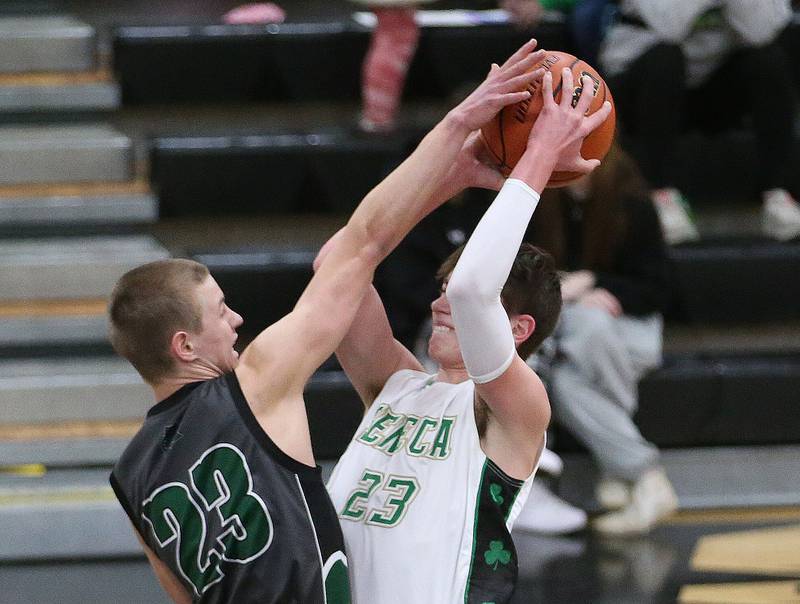 Seneca's Brady Sheedy eyes the hoop as Midland's Ben Collins defends during the Tri-County Conference Tournament on Thursday, Jan. 25, 2024 at Putnam County High School.