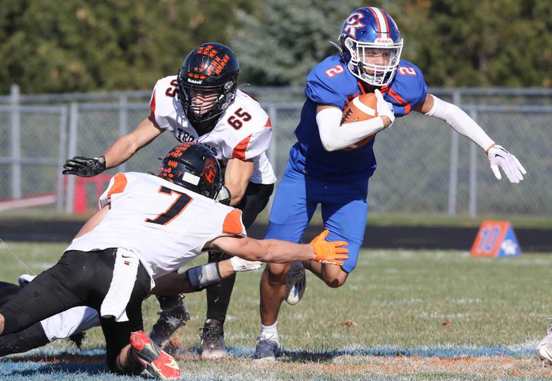Genoa-Kingston's Traven Atterberry gets by Elmwood’s Bo Windish during their first round playoff game Saturday, Oct. 29, 2022, at Genoa-Kingston High School.