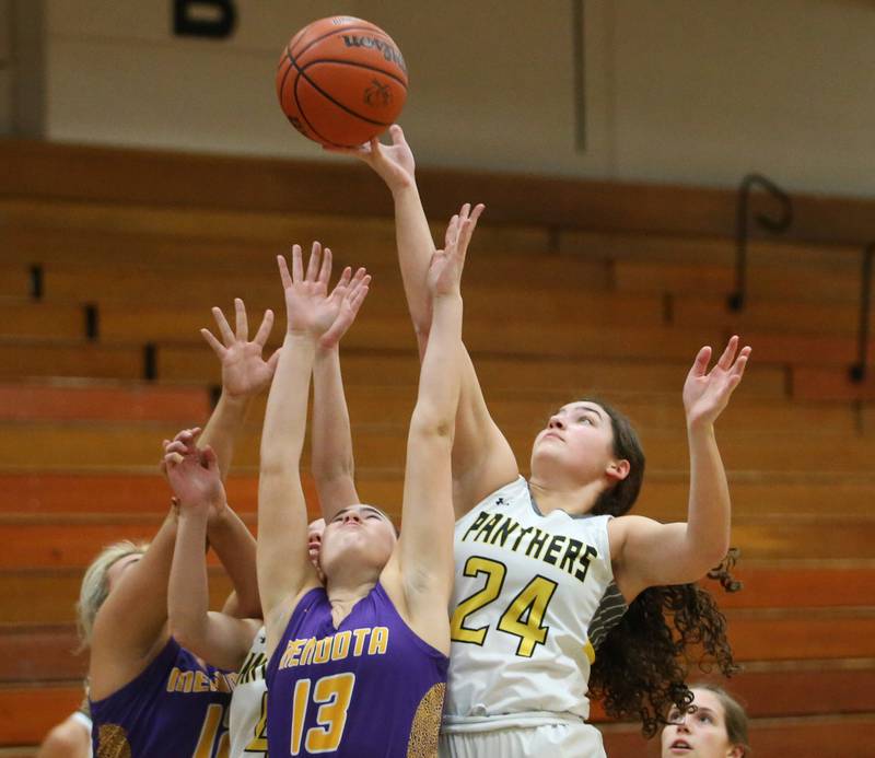Putnam County's Maggie Richetta grabs a rebound over Mendota's Ella Martin during the Princeton High School Lady Tigers Holiday Tournament on Tuesday, Nov. 14, 2023 in Prouty Gym.