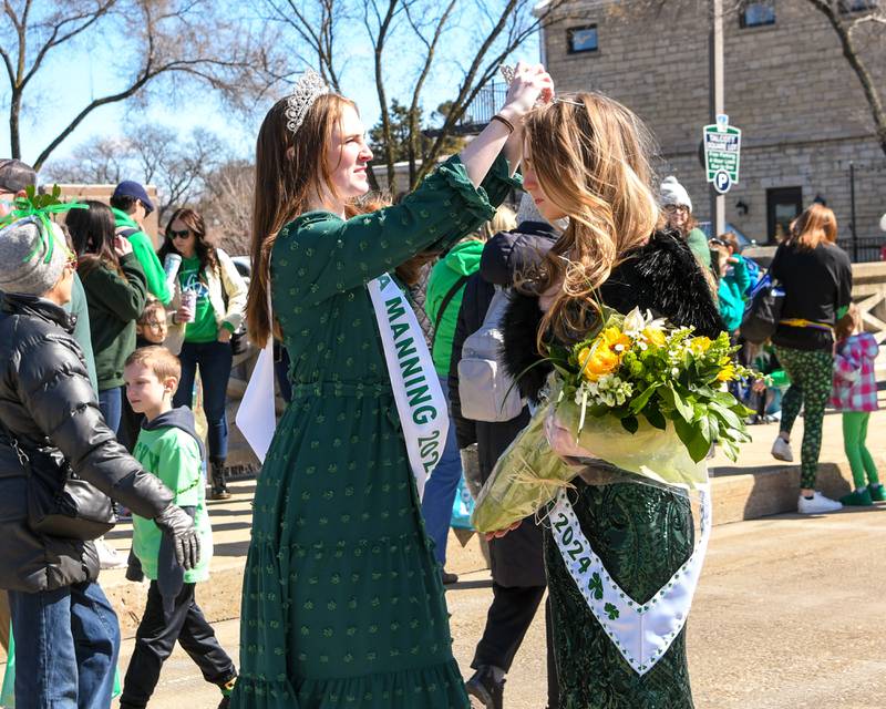 Shea Manning, left, the 2023 St. Patrick’s Day Queen crowns Brayah Bromberek the 2024 St. Patrick’s Day Queen before the start of the St. Patrick’s parade in downtown Lemont on Saturday March 8, 2024.