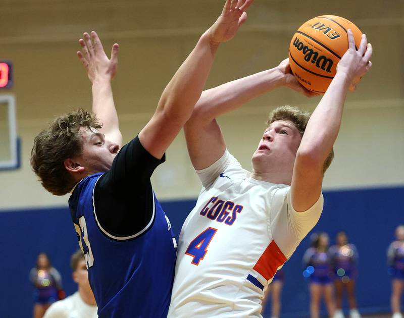 Genoa-Kingston's Cody Cravatta shoots over Hinckley-Big Rock's Luke Badal Tuesday, Jan. 6, 2026, during their game at Genoa-Kingston High School.