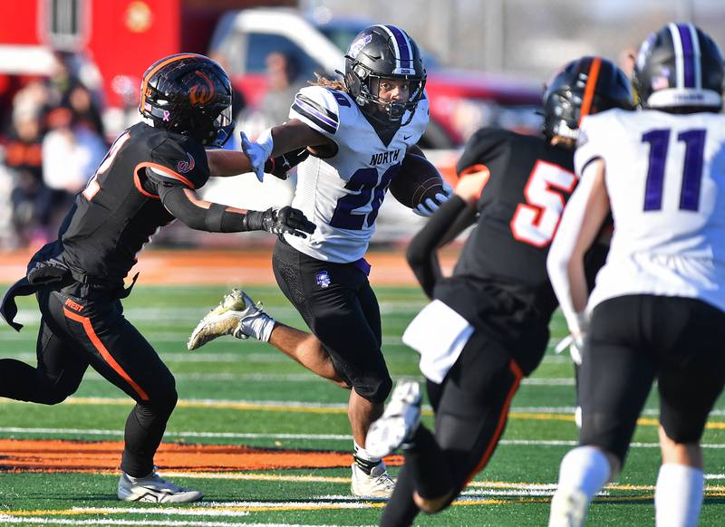 Downers Grove North's Noah Battle sweeps the left side during an IHSA Class 7A quarterfinal game against Lincoln-Way West on Nov. 11, 2023 at Lincoln-Way West High School in New Lenox.