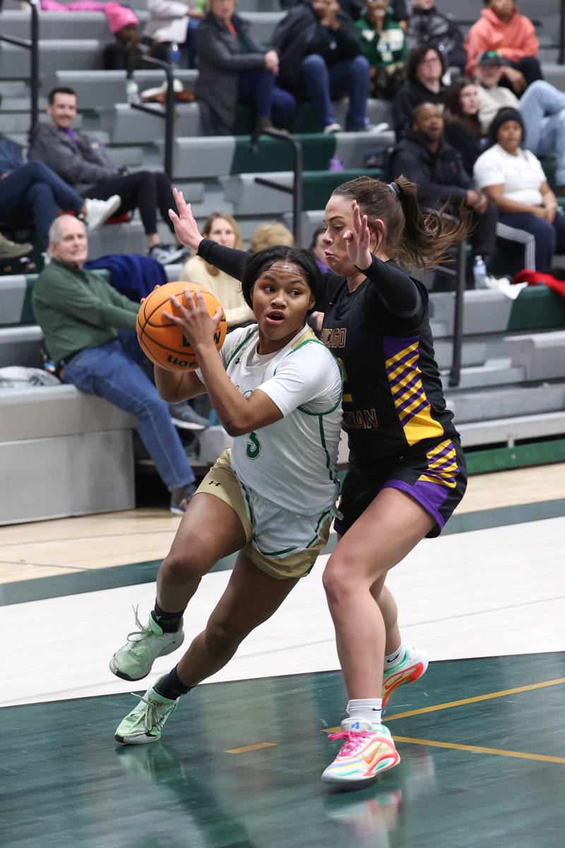 Bishop McNamara's Eliana Isom drives to the lane during the Fightin' Irish's 67-27 victory over Chicago Christian on Monday, Jan. 26, 2026.