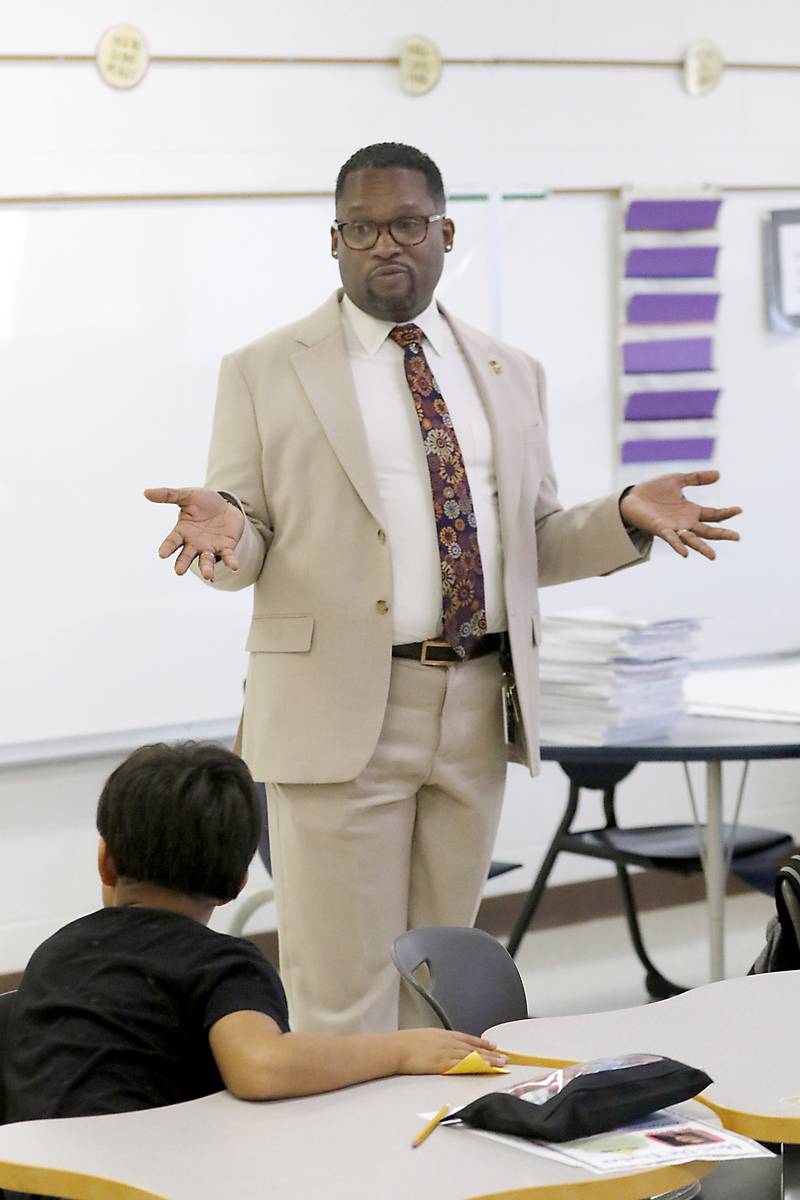 Harvard School District 50 Superintendent Brandon White explains his position to fifth grade students at Jefferson Elementary School during the first day of school on Wednesday, Aug. 13, 2025, in Harvard. White was previously was the superintendent of Cary School District 26.