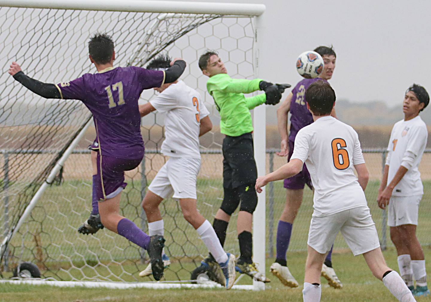 Sandwich's keper Johnathon Carlson looks to block the ball as Serena's Richie Armour (20) and teammate Beau Raikes (17) try to get the ball in the goal in the Class 1A Regional semifinal game on Tuesday, Oct. 11, 2022 in Serena.