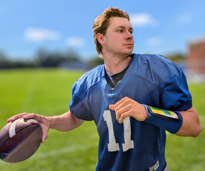 Woodstock senior quarterback Caden Thompson poses for a picture during practice Thursday, Aug. 21, 2005, in Woodstock. He is playing his third season as the Blue Streaks' starting QB.