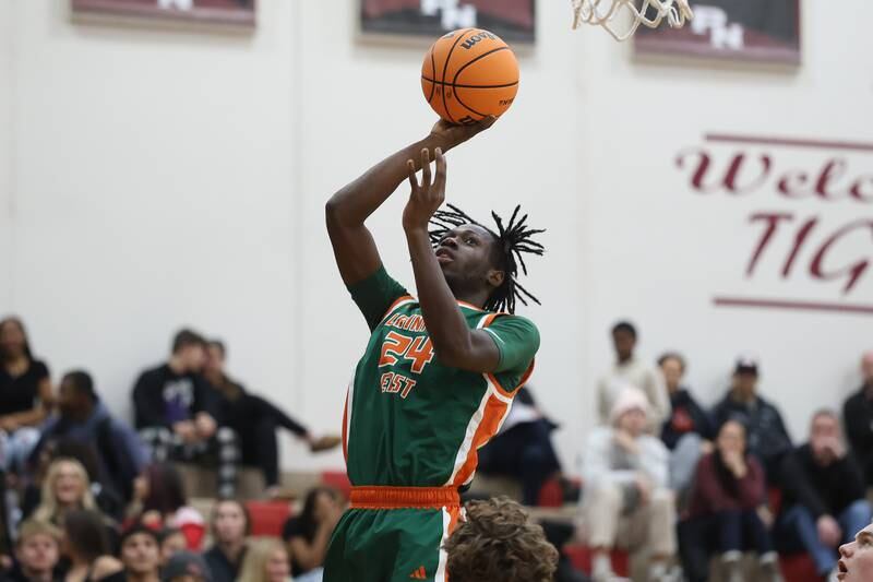 Plainfield East’s Nana Atakorah-Yanz takes a shot against Plainfield North on Tuesday, Dec. 9, 2025 in Plainfield.