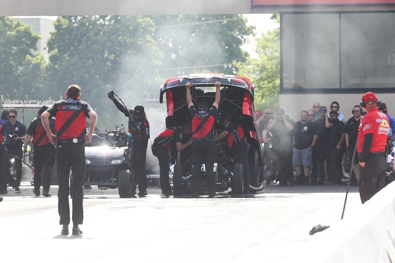 Matt Hagan’s crew makes last second checks before the start of the Funny Car championship race at the NHRA’s Gerber Collision and Glass Route 66 Nationals at Route 66 Raceway on Sunday, May 19, 2024 in Joliet.