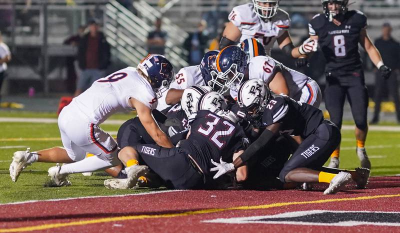 Plainfield North forces an Oswego fumble for a turnover in the red zone during a football game at Plainfield North High School on Friday, Sept. 22, 2023.