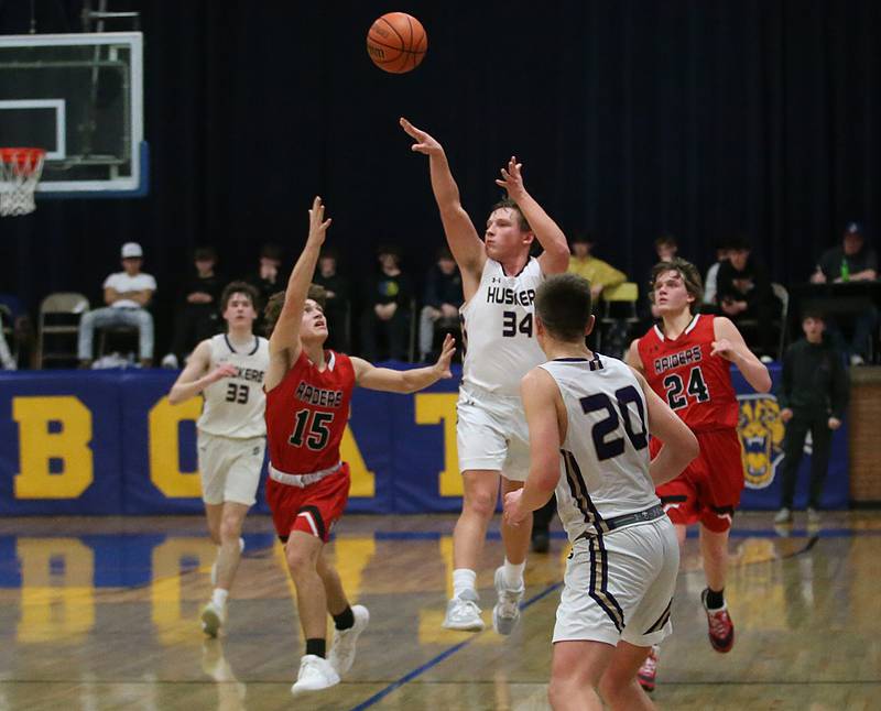Serena's Matt Farell shoots a long shot at the buzzer of the first half over Earlville's Trenton Fruit during the Little Ten Conference Championship on Friday, Feb. 2, 2024 at Somonauk High School.