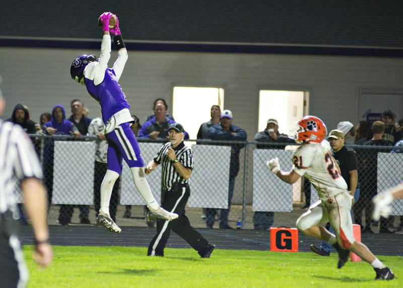 Dixon's Jath St. Pier hauls in a pass for a 2-point conversion Friday, Oct. 15, 2021 against Byron.