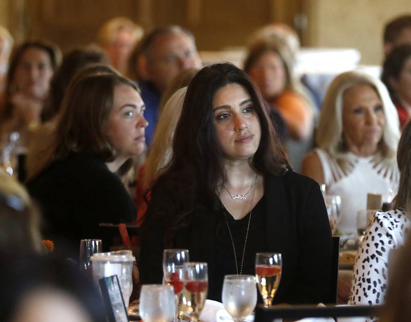 Women listen to an award winner speak during the Northwest Herald's Women of Distinction award luncheon Wednesday June 29, 2022, at Boulder Ridge Country Club, 350 Boulder Drive in Lake in the Hills. The luncheon recognized 10 women in the community as Women of Distinction plus Lisa Hoeppel as the first recipient of the Kelly Buchanan Woman of Inspiration award.