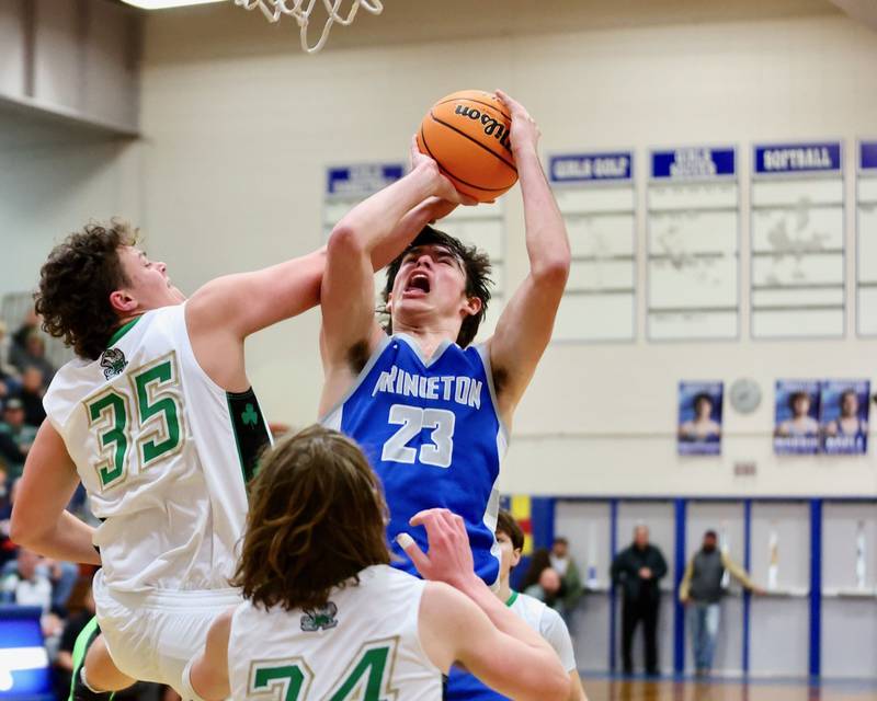 Princeton's Noah LaPorte gets a helping hand from Seneca's Zeb Maxwell in Friday's regional finals at Prouty Gym. The Tigers won 59-53 to claim their fourth straight regional title.