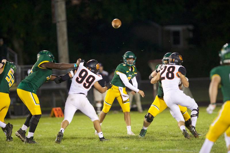 Crystal Lake South's Caden Casimino throws a pass for a gain against Crystal Lake Central on Friday Sept.30,2022 in Crystal Lake.