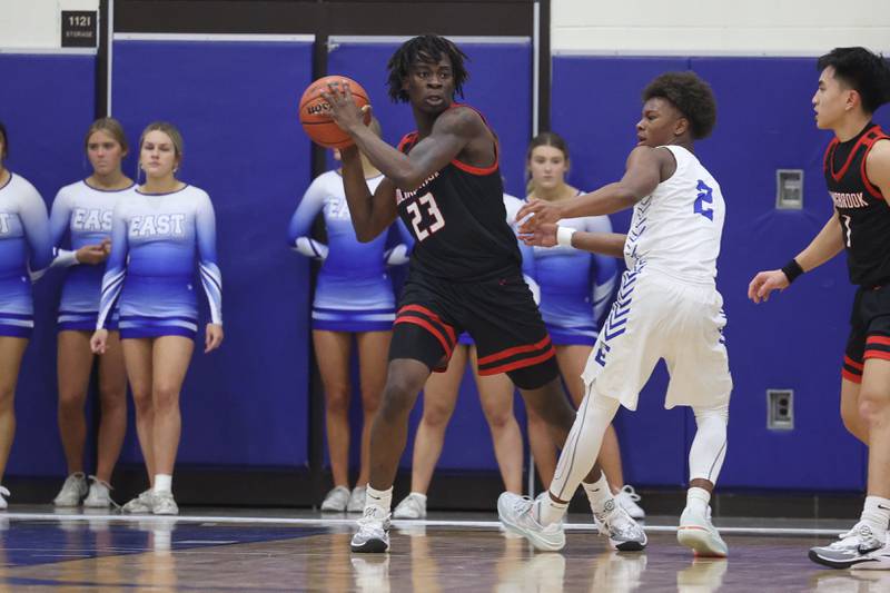 Bolingbrook’s Jason Lawani looks to pass after the rebound against Lincoln-Way East on Tuesday, Dec.12th, 2023 in Frankfort.