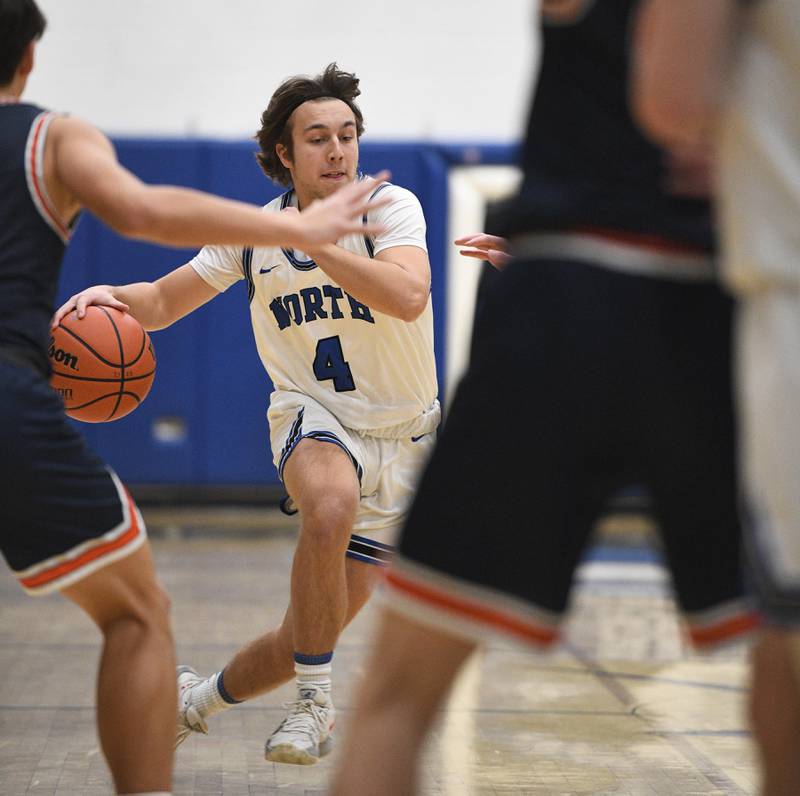 St. Charles North’s Clayton Rey drives against Naperville North in a boys basketball game in St. Charles on Wednesday, January 18, 2023.
