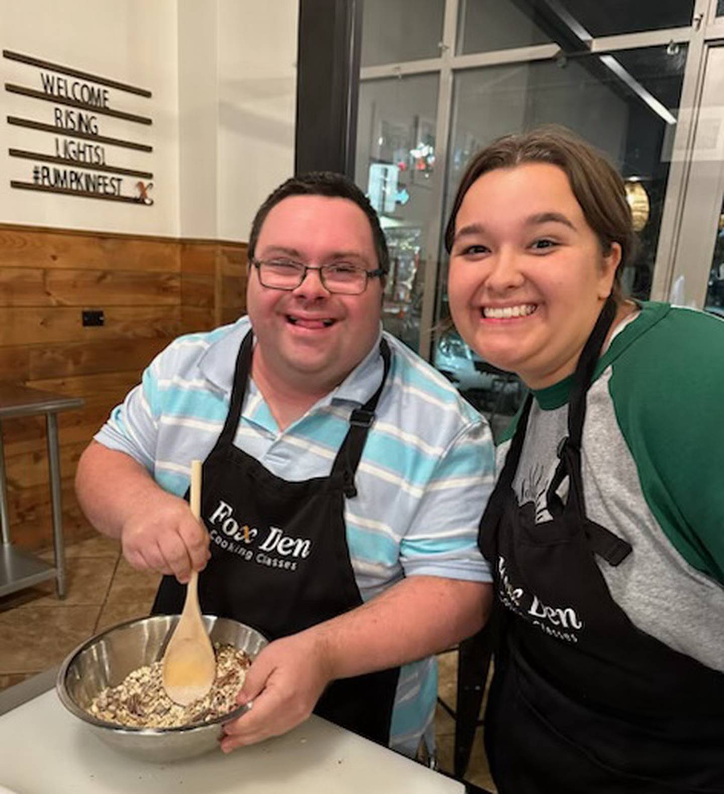 David Luplow of Elgin and Nola Noring make homemade granola at Fox Den Cooking during a Rising Lights cooking program. Noring is the student program assistant at the Rising Lights Program, a nonprofit in St. Charles that serves adults with disabilities with opportunities for socialization and education.