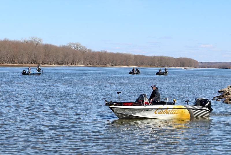 An angler drives a Cabella's boat near the Spring Valley Boat Club during the National Walleye Tour Masters Walleye Circuit on Saturday, March 23, 2024 in Spring Valley.