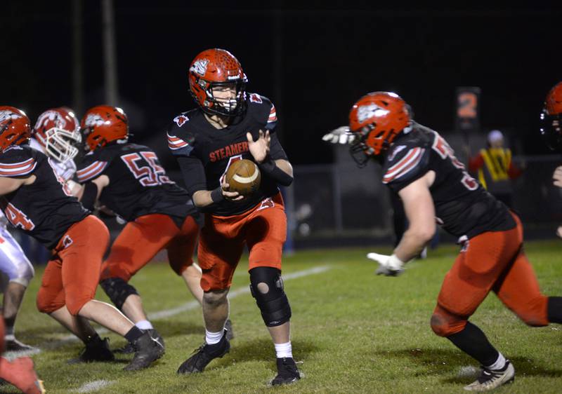 Fulton's Dom Kramer (4) hands the ball to Skylier Crooks (33) during action against Morrison on Friday, Oct. 25, 2024 in Fulton. Kramer was injured earlier in the season and came in for a couple of plays on Friday during Senior Night.