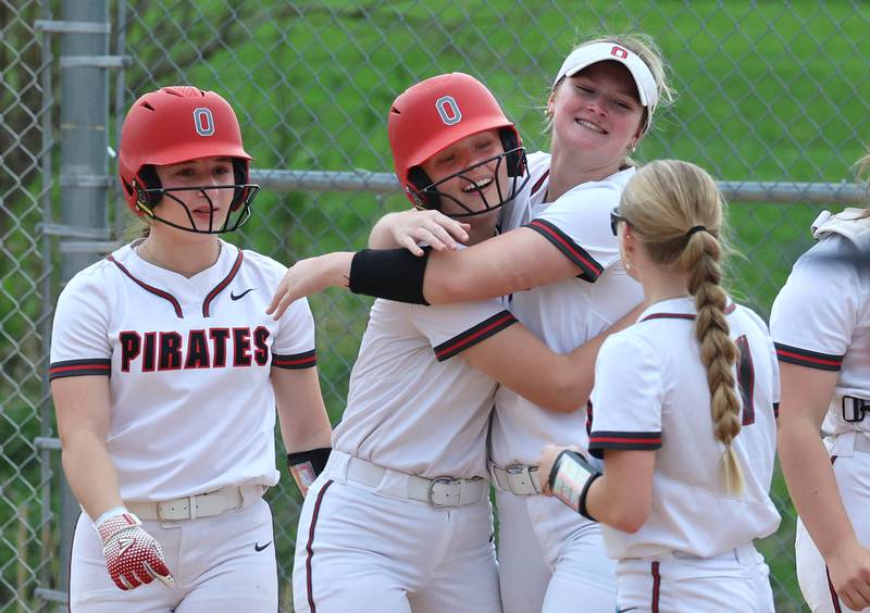 Ottawa's Joslyn Rose is greeted at home plate after homering Friday, April 17, 2026, during thier game at Sycamore High School.