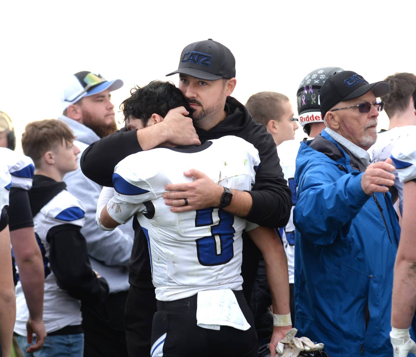 Eastland-Pearl City coach Jared McNutt gives senior Tanner Stern a hug after EPC fell  to Taylor-Rockridge 22-8 in the 2A state football playoff's first round on Saturday, Nov. 2, 2024 at Eddington.