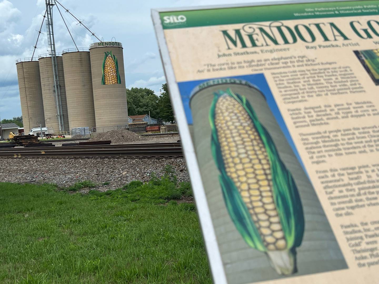 Mendota Gold, the 68-foot-tall ear of corn that was hand painted on metal panels, will be fully removed from its spot on the side of a concrete silo by the railroad tracks. According to NCI ARTworks Executive Director Julia Messina, Northern Partners, owners of the property, have decided to demolish the silo on which it was installed.