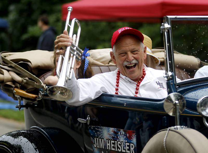 Parade grand marshal Jim Heiser reacts to the crowd on Sunday, July 2, 2023 during Crystal Lake’s annual Independence Day Parade on Dole Avenue in Crystal Lake. This year’s parade feature close to 100 units.